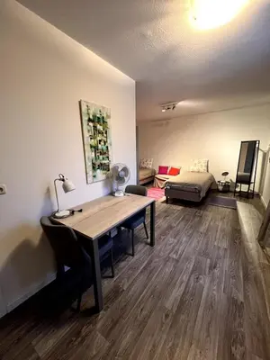 a room with a desk and a bed in a room at Maison Melis Antwerp in Antwerp