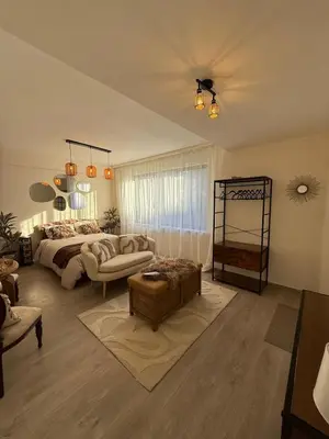 a living room with a bed and a couch at Calm & Stylish Apartment Atomium Area Bruxelles in Wemmel
