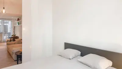 two pillows sitting on a bed in a living room at Modern apartment near City Centre, Luna CasaMia in Mellet