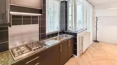 a kitchen with a sink and a stove top oven at Modern apartment near City Centre, Luna CasaMia in Mellet