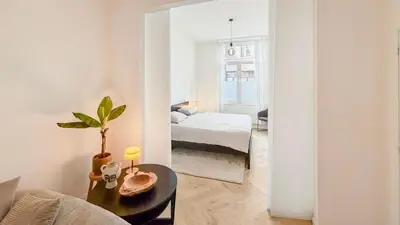 a bedroom with a bed and a room with a mirror at Modern apartment near City Centre, Luna CasaMia in Mellet