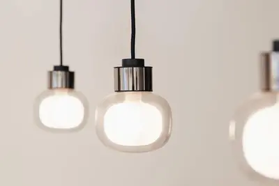 a group of light bulbs hanging from a ceiling at Guesthouse Dolores with Breakfast perfect for Tomorrowland Festival in Waasmunster