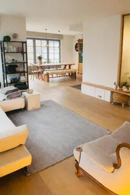a living room with a couch and a table at Guesthouse Dolores with Breakfast perfect for Tomorrowland Festival in Waasmunster