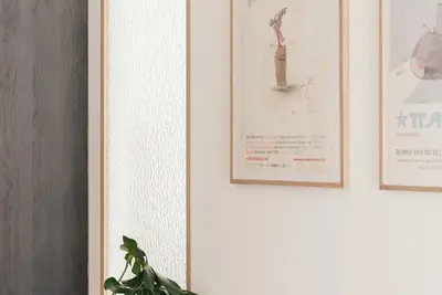 three pictures hanging on a wall with a plant at Guesthouse Dolores with Breakfast perfect for Tomorrowland Festival in Waasmunster