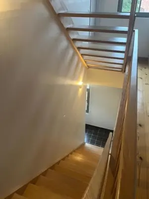 a hallway with a staircase with a roof at Guesthouse Dolores with Breakfast perfect for Tomorrowland Festival in Waasmunster
