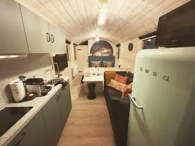 a kitchen with a refrigerator and a sink in it at Laurel & Hardy in Mechelen