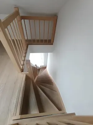 a spiral staircase in a room with white walls at Excelente localização in Brussels