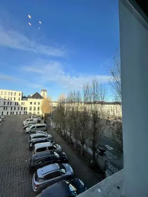 a row of cars parked in a parking lot at sint-pietersplein duplex 9 in Ghent