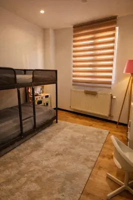 a bedroom with two bunk beds and a window at Tomorrowland Luxury Apartment in Boom