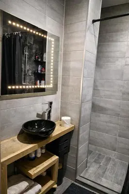 a bathroom with a sink and a shower at Tomorrowland Luxury Apartment in Boom