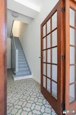 an open door in a hallway with a staircase at Beautiful loft in Antwerp Berchem in Antwerp
