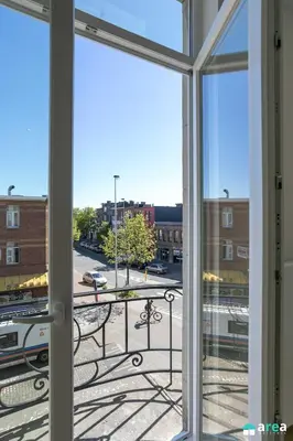 an open window with a view of a city street at Beautiful loft in Antwerp Berchem in Antwerp