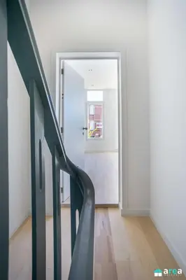 a staircase leading to a door in a room at Beautiful loft in Antwerp Berchem in Antwerp
