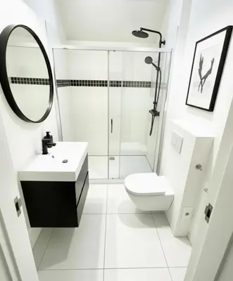 a white bathroom with a shower and a toilet at Rooms at Université Libre de Bruxelles in Brussels