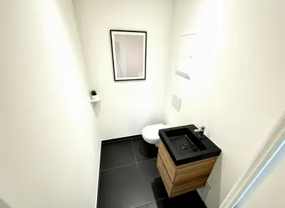 a small bathroom with a sink and a toilet at Rooms at Université Libre de Bruxelles in Brussels