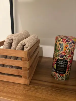 a couple of wooden boxes sitting on a table with a bag of food at Modern 1BR and Sofa Bed Near Airport in Brussels