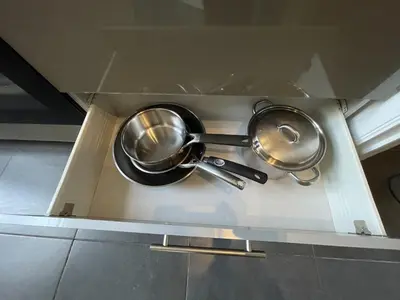 a set of pots and pans in a box at Beautiful condominium with jacuzzi in Brussels