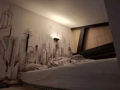 a bedroom with a wall with a drawing on the wall at Premium Loft in Antwerp Featured on TV in Antwerp
