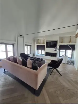 a large living room with a couch and a tv at Chique loft uitzicht kathedraal Antwerpen in Antwerp