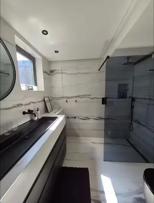a bathroom with a sink and a shower at Chique loft uitzicht kathedraal Antwerpen in Antwerp
