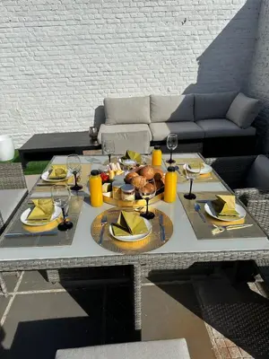 a table with plates of food and wine glasses at Antwerp West Side, Fireplace in Zwijndrecht