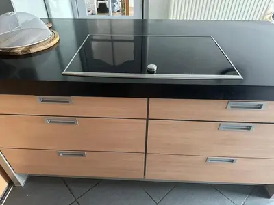 a black counter with a tv on top of a dresser at Antwerp West Side, Fireplace in Zwijndrecht
