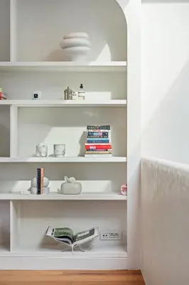 a room with white shelves with books at Ultra-luxe penthouse, 3 slpks, toplocatie in Antwerp