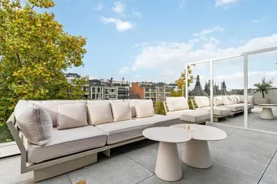 a white couch sitting on top of a balcony at Ultra-luxe penthouse, 3 slpks, toplocatie in Antwerp