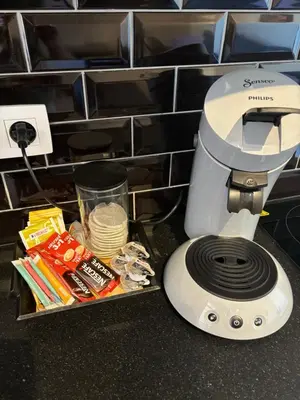 a food processor sitting on top of a counter with food at Apartment central Lier in Lier
