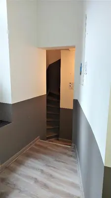 an empty room with stairs and a hallway at Chez Esmara Et Philippe Fourche in Brussels