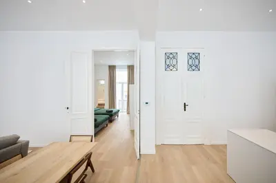 a living room with a couch and a table at Louise City 2 in Brussels