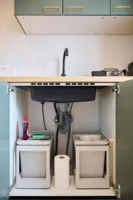 a sink and two toilets under a counter at Apartement Berthelot 5 in Brussels