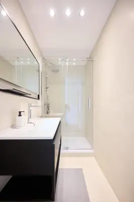 a bathroom with a sink and a shower at Apartement Berthelot 5 in Brussels