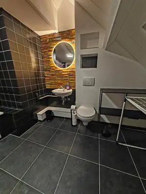 a bathroom with a sink and a toilet at The Nest in Antwerp