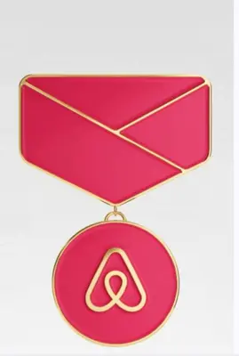 a pink necklace with a peace sign on it at Euro Edens Brussels - Cozy Family Suite in Brussels