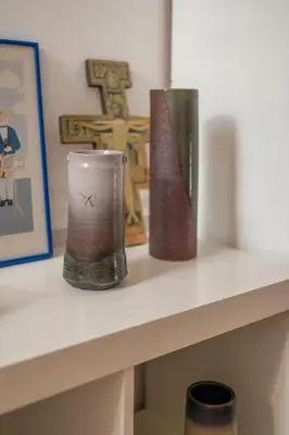 two vases are sitting on a shelf at Euro Edens Brussels - Cozy Family Suite in Brussels