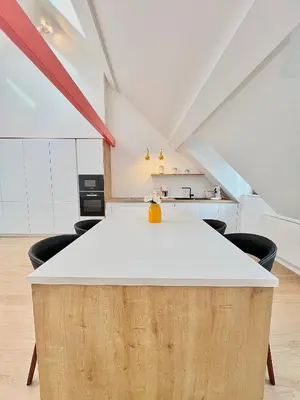 an office with a white table and chairs at Duplex Design & Élégant au Coeur de Bruxelles in Brussels