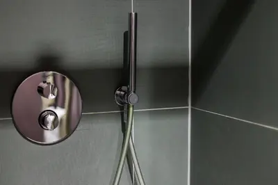a shower in a bathroom with a mirror at ROMY ANTWERP Sint-Jansvliet in Antwerp