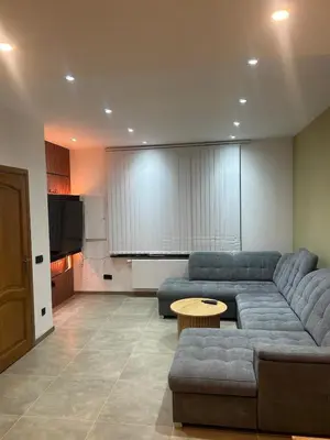 a living room with a couch and a table at Sisel Apart House in Temse