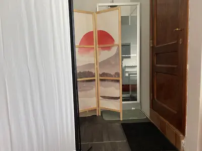 a room with a closet with a glass door at River City in Beersel