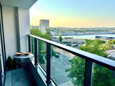 a balcony with a view of a parking lot at Elegant Apartment Near Atomium Ideal for Families in Brussels