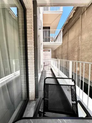 a balcony with a bench in a building at Lovely Studio with Balcony by Grand Place for 4 in Brussels