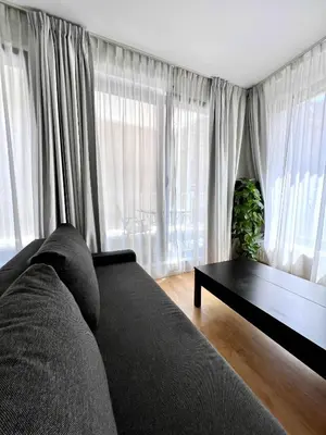 a living room with a couch and a table at Lovely Studio with Balcony by Grand Place for 4 in Brussels