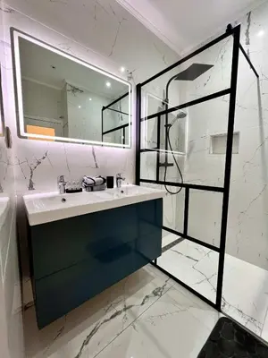 a bathroom with a sink and a mirror at Cosy Family Apartment for up to 9 guests near Brussels Midi Station in Brussels