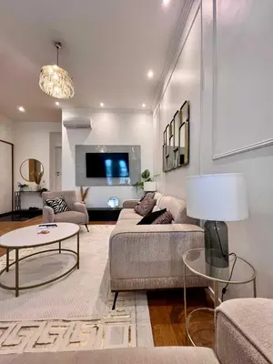 a living room with a couch and a table at Cosy Family Apartment for up to 9 guests near Brussels Midi Station in Brussels