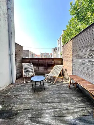 a patio with two chairs and a table and a bench at Cosy Family Apartment for up to 9 guests near Brussels Midi Station in Brussels