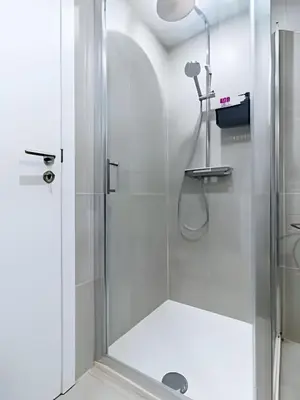 a shower with a glass door in a bathroom at Studio idéal pour visiter Bruxelles in Brussels