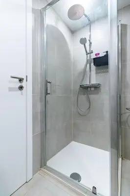 a shower with a glass door in a bathroom at Studio idéal pour visiter Bruxelles in Brussels