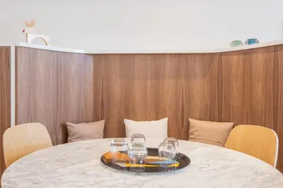 a table with wine glasses on top of it at New Apartment center of Trendy St Gille in Brussels