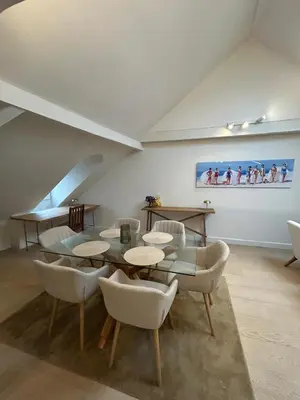 a dining room with a table and chairs at Historic Charm Penthouse Leuven in Leuven